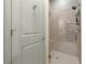 Shower featuring tiled walls, glass door and nickel showerhead at 422 Bill Kennedy Se Way, Atlanta, GA 30316