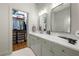 Spacious bathroom featuring double sinks, granite countertops, and walk in closet at 422 Bill Kennedy Se Way, Atlanta, GA 30316