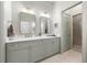 Well-lit bathroom featuring double sinks, granite countertop, walk in shower and neutral colors at 422 Bill Kennedy Se Way, Atlanta, GA 30316