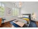 Bright bedroom with plantation shutters, modern decor and hardwood floors at 422 Bill Kennedy Se Way, Atlanta, GA 30316