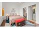 Cozy bedroom with a colorful rug and wooden chest, leading to a bathroom and stairway at 422 Bill Kennedy Se Way, Atlanta, GA 30316