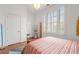 Bright bedroom featuring neutral decor, large window with plantation shutters and wood flooring at 422 Bill Kennedy Se Way, Atlanta, GA 30316