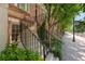 Exterior stairway leading to townhome with black metal railings, beautiful greenery and well maintained sidewalk at 422 Bill Kennedy Se Way, Atlanta, GA 30316