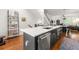 Open concept kitchen with marble island and stainless steel appliances that overlook the living area at 422 Bill Kennedy Se Way, Atlanta, GA 30316