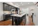 Bright kitchen with dark cabinets, marble countertops, and stainless steel appliances at 422 Bill Kennedy Se Way, Atlanta, GA 30316