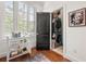Laundry room with stackable washer and dryer, next to window with bright light and built in blinds at 422 Bill Kennedy Se Way, Atlanta, GA 30316