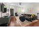 Stylish living room with hardwood floors, comfortable seating, contemporary decor, and bright windows at 422 Bill Kennedy Se Way, Atlanta, GA 30316