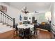 Open-concept living room and dining area with modern furnishings and hardwood floors at 422 Bill Kennedy Se Way, Atlanta, GA 30316