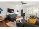 Bright living room showcasing hardwood floors, modern furniture, artistic decor, and ample natural light at 422 Bill Kennedy Se Way, Atlanta, GA 30316