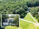 Expansive aerial view of a home with a long driveway and surrounding lush greenery and mature trees at 5427 Highway 81, Loganville, GA 30052