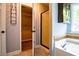 Bright bathroom with a standalone shower and separate tub at 5427 Highway 81, Loganville, GA 30052