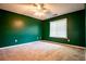 Spacious bedroom featuring plush carpeting and a bright window at 5427 Highway 81, Loganville, GA 30052