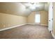 Large carpeted bedroom features a vaulted ceiling and a bright window at 5427 Highway 81, Loganville, GA 30052