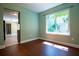 Dining area with wood floors and a window, creating a welcoming space to gather and enjoy meals at 5427 Highway 81, Loganville, GA 30052