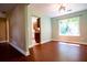 Dining area next to kitchen with window views offering natural light and wood floors at 5427 Highway 81, Loganville, GA 30052