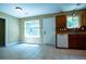 Bright kitchen space features tiled floors, a dishwasher, and natural light from the window at 5427 Highway 81, Loganville, GA 30052