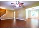 Spacious living room with wood floors, complemented by an open layout and staircase at 5427 Highway 81, Loganville, GA 30052