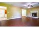 Inviting living room with fireplace, wood flooring, and natural light, ideal for relaxation and entertainment at 5427 Highway 81, Loganville, GA 30052