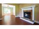 A cozy fireplace enhances the charm of this living room, flowing into other living spaces at 5427 Highway 81, Loganville, GA 30052