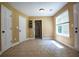 Bright room showcasing a tile floor and multiple white doors for ample storage at 5427 Highway 81, Loganville, GA 30052