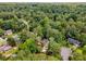 Aerial shot of a property with lush surrounding trees in a serene and private neighborhood at 5714 Braddock Ct, Atlanta, GA 30350