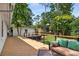 Exterior featuring deck with cozy outdoor seating and spacious backyard at 5714 Braddock Ct, Atlanta, GA 30350