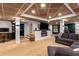 Finished basement with a coffered wood ceiling, modern fireplace, and entertainment setup at 5714 Braddock Ct, Atlanta, GA 30350