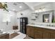 Elegant bathroom featuring double sinks, a marble countertop, and a glass-enclosed shower at 5714 Braddock Ct, Atlanta, GA 30350