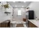 Bright bathroom featuring a glass enclosed shower, a wooden cabinet, and updated features at 5714 Braddock Ct, Atlanta, GA 30350