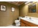 Powder room featuring decorative mirror, wainscoting, and wood-look ceiling at 5714 Braddock Ct, Atlanta, GA 30350