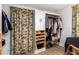 Walk-in closet with built-in storage solutions for shoes and hanging clothes at 5714 Braddock Ct, Atlanta, GA 30350