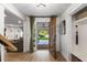 Inviting entryway with a glass door leading to a landscaped yard at 5714 Braddock Ct, Atlanta, GA 30350
