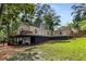 Beautiful home featuring an elevated deck and a well-manicured lawn, perfect for outdoor enjoyment at 5714 Braddock Ct, Atlanta, GA 30350