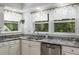 Bright kitchen with stainless steel sink, granite countertops, and ample storage at 5714 Braddock Ct, Atlanta, GA 30350