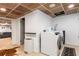 Laundry room with front load washer/dryer, tile flooring, and access to living area at 5714 Braddock Ct, Atlanta, GA 30350