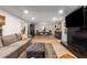 Open concept living room flowing into the dining area, featuring a modern fireplace at 5714 Braddock Ct, Atlanta, GA 30350