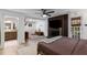 Main bedroom showcasing fireplace, television and ensuite bathroom entrance at 5714 Braddock Ct, Atlanta, GA 30350