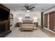 Well-lit main bedroom featuring ceiling fan and access to the outdoors at 5714 Braddock Ct, Atlanta, GA 30350