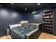 Home theater with custom black paint, projection screen, and bonus sleeping area at 5714 Braddock Ct, Atlanta, GA 30350
