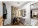 Bright vanity area with a lighted mirror and adjacent closet for convenient dressing and grooming at 5714 Braddock Ct, Atlanta, GA 30350
