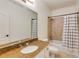 Bathroom featuring a granite countertop, large mirror, and a bathtub with a tiled shower at 930 Shepards Ct, Roswell, GA 30075