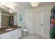Stylish bathroom with a granite countertop, contemporary lighting, and colorful shower curtain at 930 Shepards Ct, Roswell, GA 30075