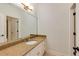 Bathroom featuring granite counters, modern fixtures, and white cabinets at 930 Shepards Ct, Roswell, GA 30075
