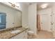 Bright bathroom features granite counters, modern fixtures, and neutral tile flooring at 930 Shepards Ct, Roswell, GA 30075