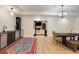 Spacious dining area with hardwood floors, modern light fixtures, and adjoining kitchen at 930 Shepards Ct, Roswell, GA 30075