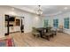 Spacious dining area with hardwood floors, modern lighting, and views into the living room at 930 Shepards Ct, Roswell, GA 30075