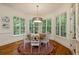 Cozy dining room filled with natural light and featuring hardwood floors and a decorative chandelier at 930 Shepards Ct, Roswell, GA 30075