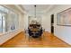Formal dining room with hardwood floors, tray ceilings, and stylish decor at 930 Shepards Ct, Roswell, GA 30075