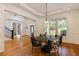 Elegant dining room with hardwood floors, white trim, and large windows offering abundant natural light at 930 Shepards Ct, Roswell, GA 30075