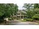 Charming two-story home with stone accents, well-manicured landscaping, and a welcoming front porch at 930 Shepards Ct, Roswell, GA 30075